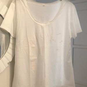 Beautiful White Tee, New and never worn. Has rose gold dandelion blowing across.